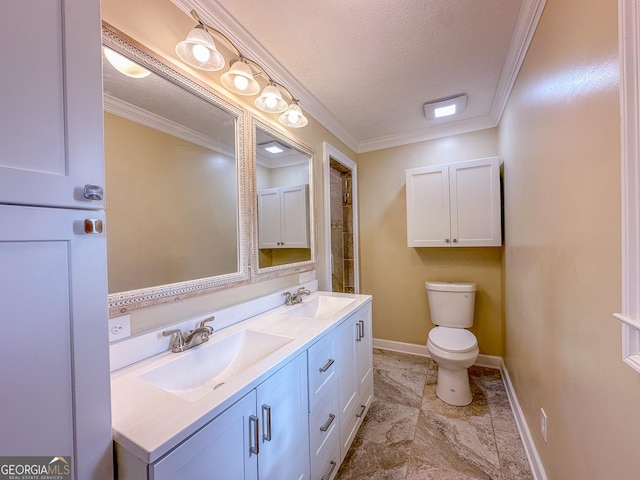 bathroom with double vanity, ornamental molding, a sink, and toilet