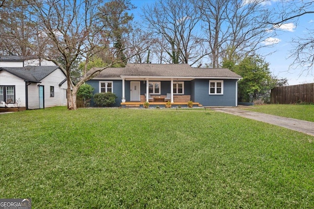 single story home with driveway, a front lawn, fence, and a porch