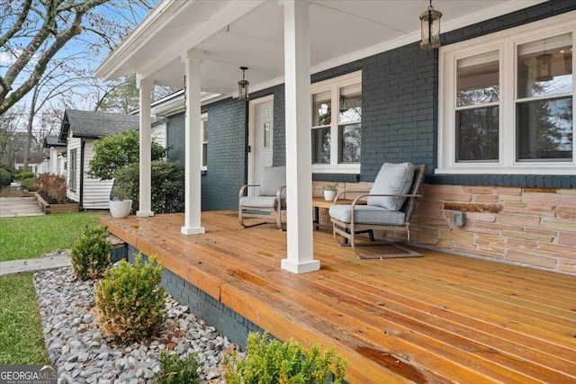 wooden terrace with a porch