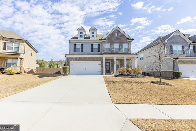 view of front facade featuring brick siding, concrete driveway, central AC, fence, and a garage