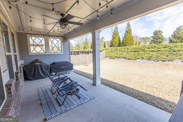 view of patio / terrace featuring a ceiling fan, fence, and grilling area