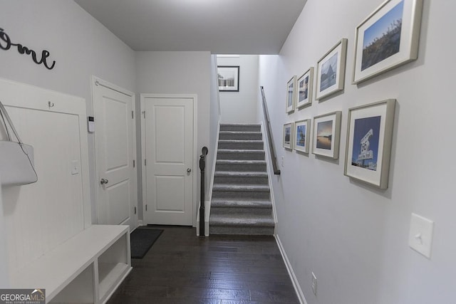 interior space featuring dark wood finished floors and baseboards