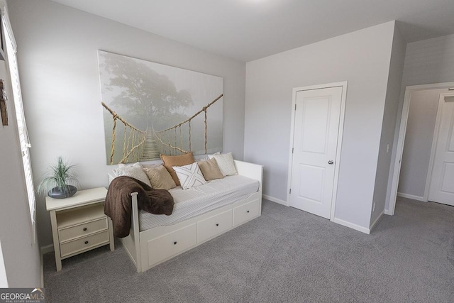 carpeted bedroom with baseboards