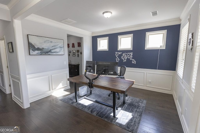 office area featuring dark wood-style floors, a decorative wall, visible vents, and crown molding