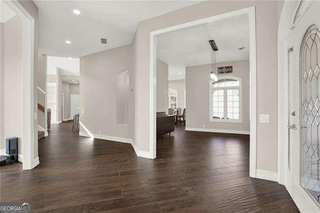 entryway featuring stairs, wood finished floors, visible vents, and baseboards