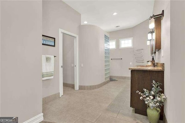 bathroom featuring recessed lighting, tile patterned flooring, vanity, and baseboards