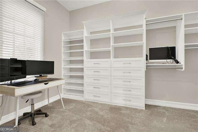 home office featuring light carpet and baseboards