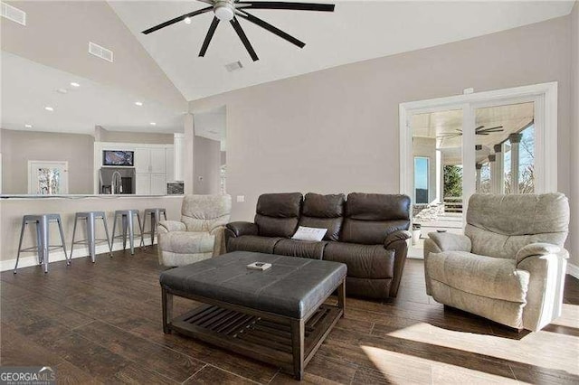 living area with ceiling fan, visible vents, and wood finished floors