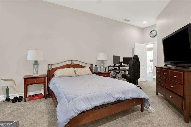 bedroom with light carpet, visible vents, and baseboards