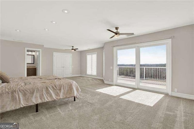 bedroom with access to outside, light colored carpet, ceiling fan, and baseboards