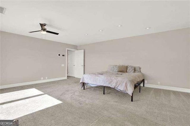 carpeted bedroom with ceiling fan, visible vents, and baseboards