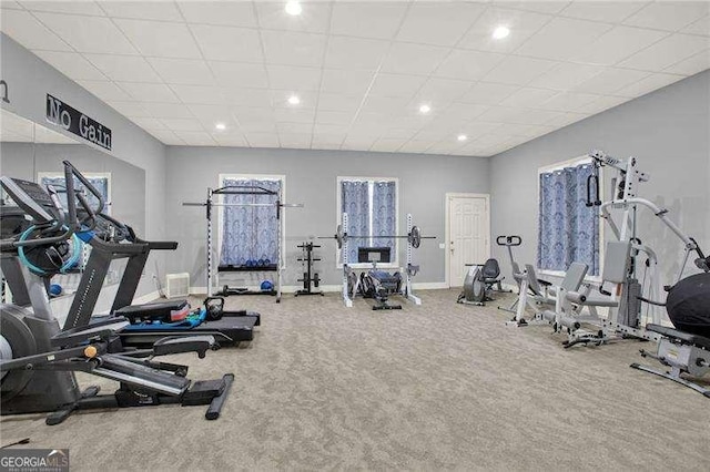 exercise room with recessed lighting, carpet, a drop ceiling, and baseboards