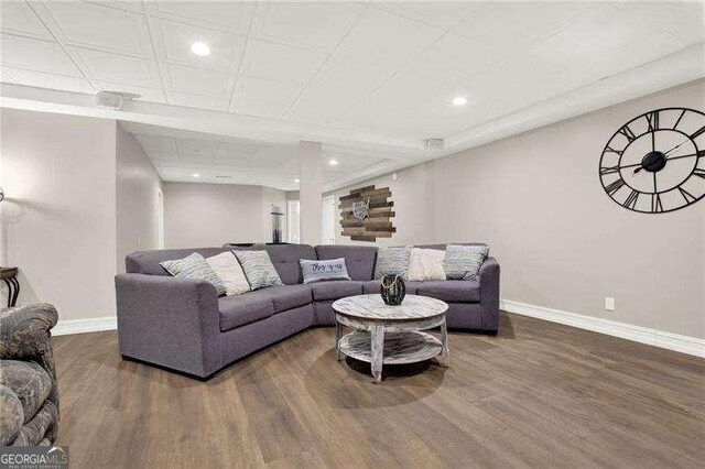 living room with recessed lighting, wood finished floors, and baseboards