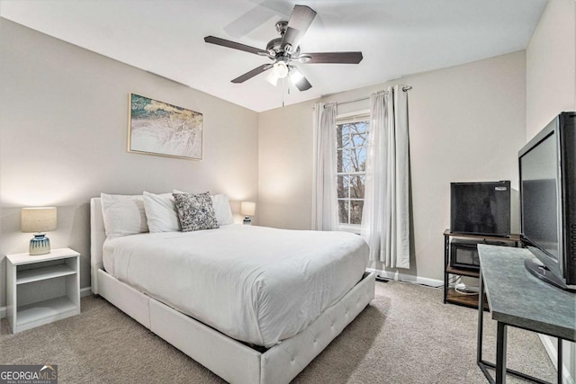 bedroom with carpet flooring, a ceiling fan, and baseboards