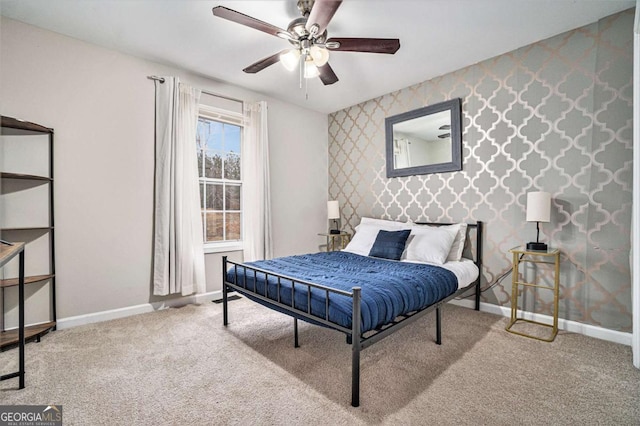 carpeted bedroom featuring baseboards, ceiling fan, and wallpapered walls