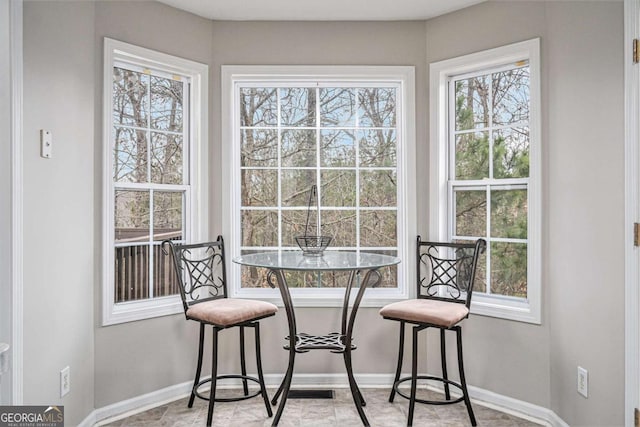 dining room featuring baseboards