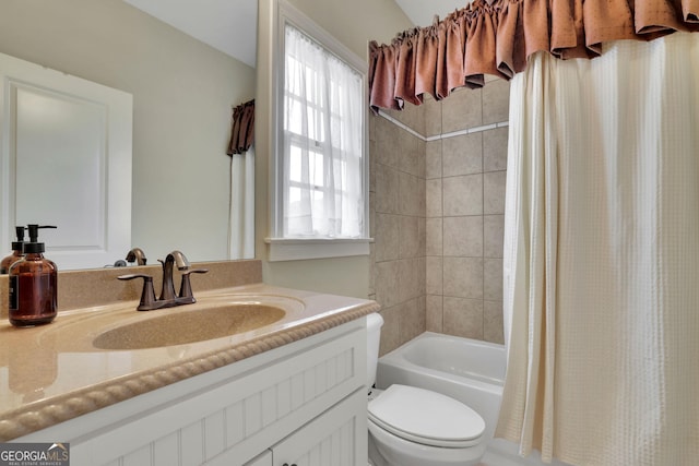 bathroom with toilet, vanity, and shower / bathtub combination with curtain