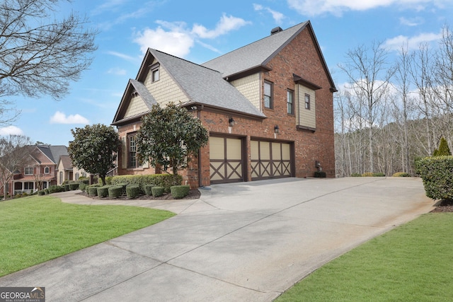 view of side of property featuring brick siding, a garage, driveway, roof with shingles, and a lawn