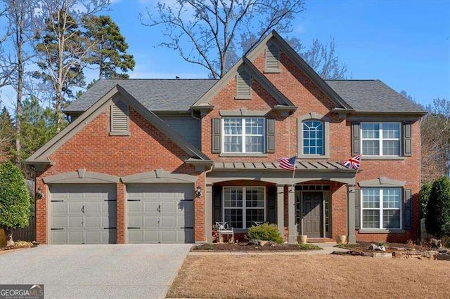 view of front facade with a garage, concrete driveway, brick siding, and a porch