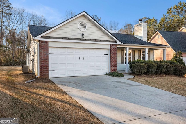 ranch-style home featuring brick siding, driveway, a shingled roof, and a garage