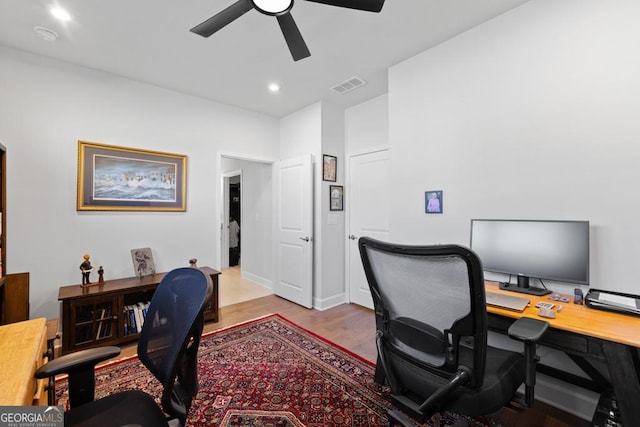 office space featuring ceiling fan, visible vents, wood finished floors, and recessed lighting