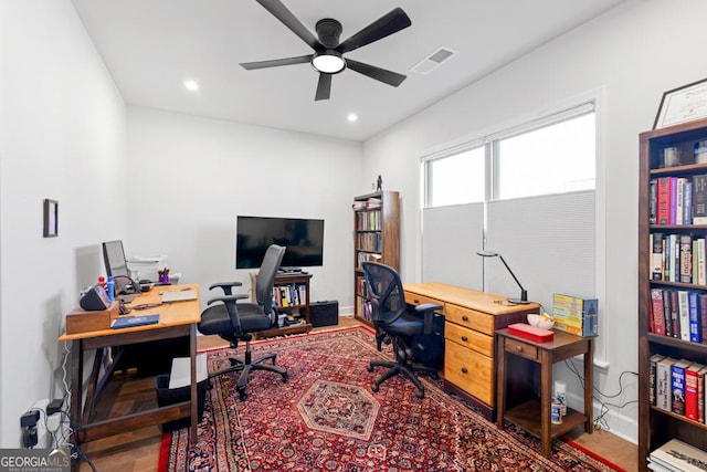 office space featuring a ceiling fan, recessed lighting, visible vents, and baseboards