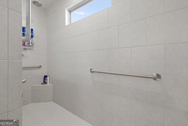 bathroom featuring tiled shower