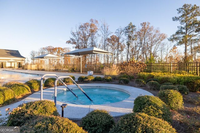 view of swimming pool with a fenced in pool and fence