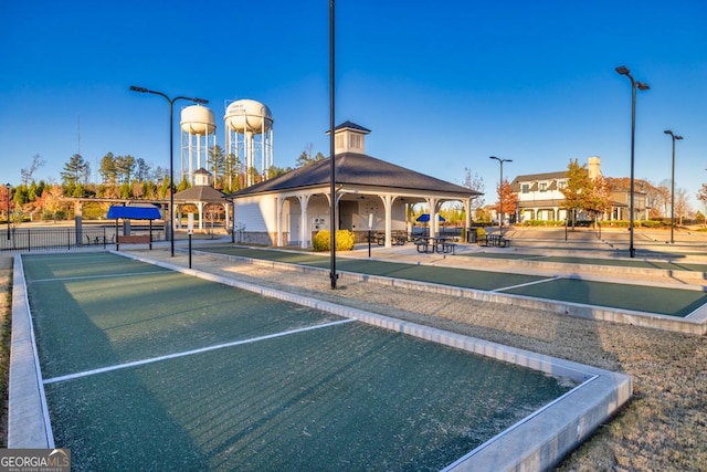 view of home's community featuring a gazebo and fence