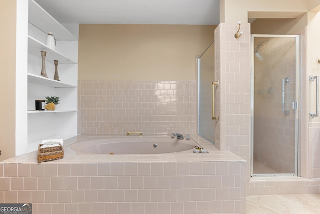 full bathroom with a stall shower, a garden tub, and tile patterned floors