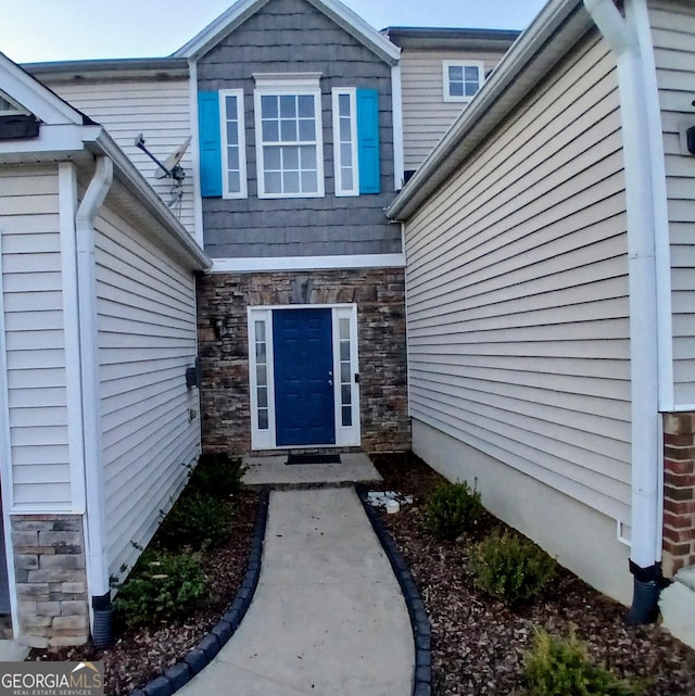 view of exterior entry with stone siding