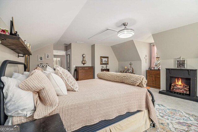487 Glendale Ct, Stone Mountain, GA 30087 - carpeted bedroom with lofted ceiling and a warm lit fireplace