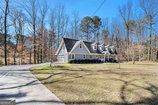 487 Glendale Ct, Stone Mountain, GA 30087 - view of front of house featuring a garage, concrete driveway, and a front lawn