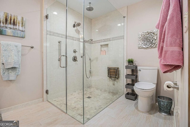 487 Glendale Ct, Stone Mountain, GA 30087 - bathroom with a stall shower, toilet, and baseboards