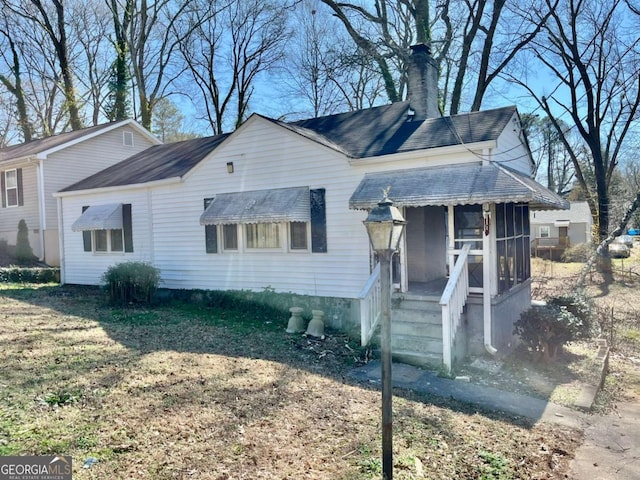 view of home's exterior featuring a chimney