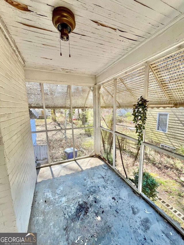 unfurnished sunroom featuring wooden ceiling and a healthy amount of sunlight