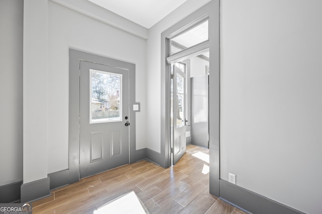 entrance foyer featuring wood finish floors and baseboards