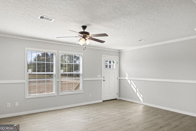 entryway with ceiling fan, wood finished floors, visible vents, and baseboards