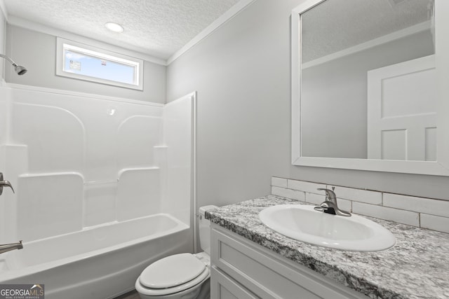 full bathroom with a textured ceiling, toilet, shower / bath combination, and vanity