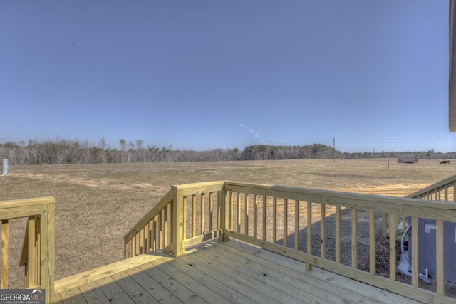 wooden terrace with a rural view