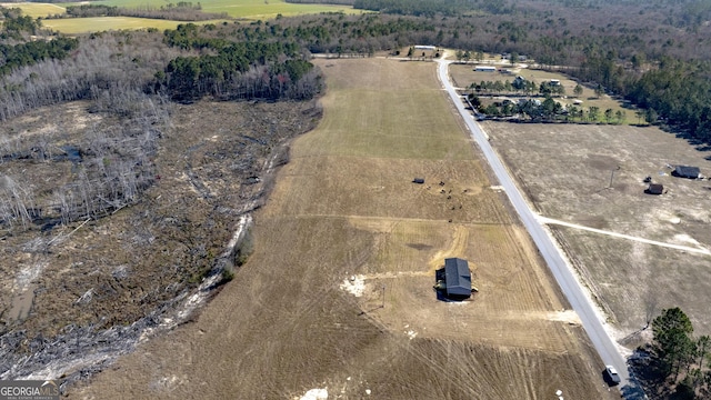 birds eye view of property featuring a rural view