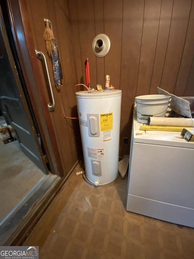 utilities featuring washer / clothes dryer and electric water heater