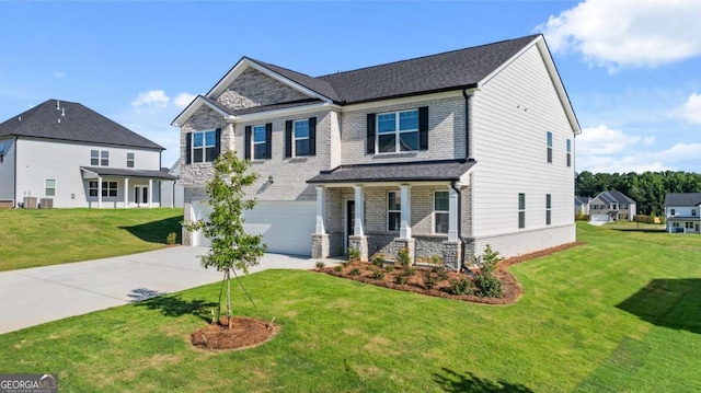 craftsman-style house with driveway, a front lawn, an attached garage, and brick siding