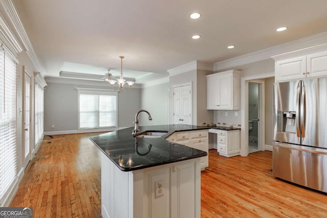 kitchen with crown molding, a sink, stainless steel refrigerator with ice dispenser, and light wood-style flooring