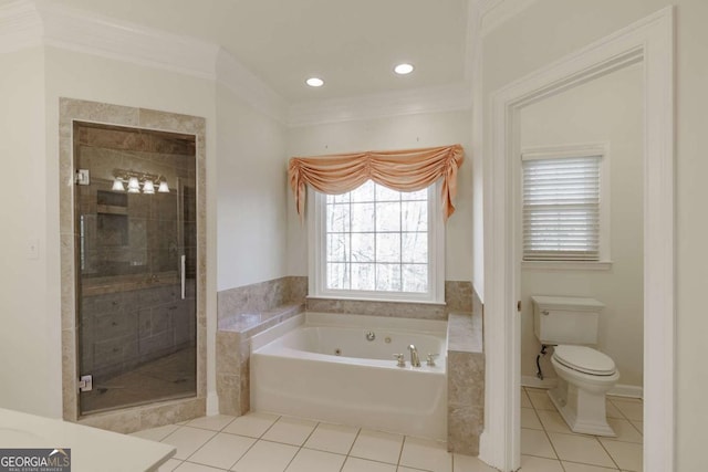 full bathroom featuring a stall shower, toilet, a tub with jets, and tile patterned floors