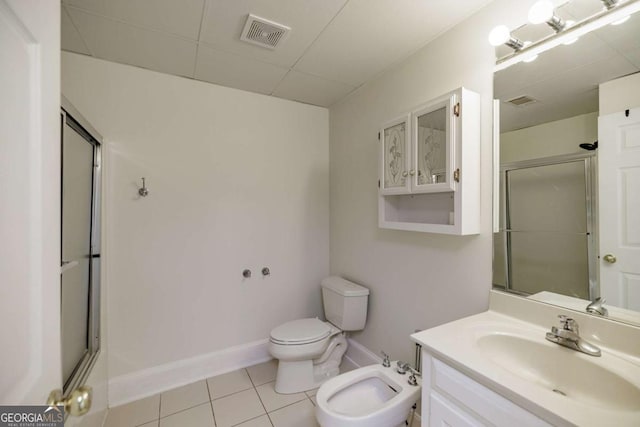 bathroom with visible vents, toilet, a stall shower, a bidet, and tile patterned flooring