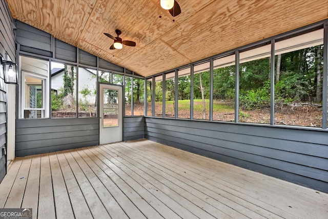 unfurnished sunroom featuring plenty of natural light, wood ceiling, vaulted ceiling, and ceiling fan