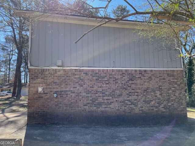 view of property exterior featuring brick siding