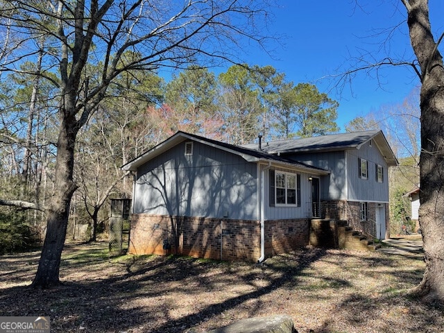 view of home's exterior featuring brick siding