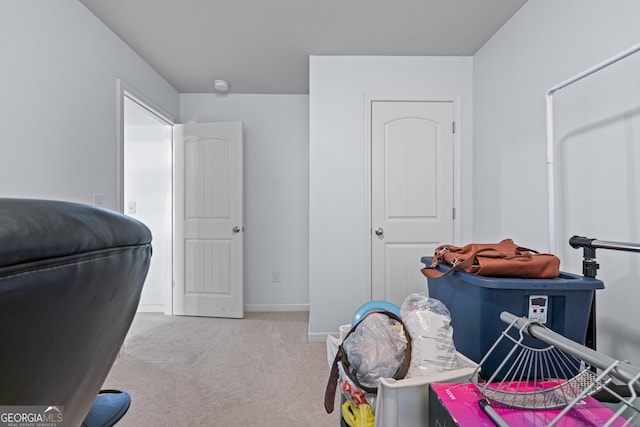 carpeted home office with baseboards